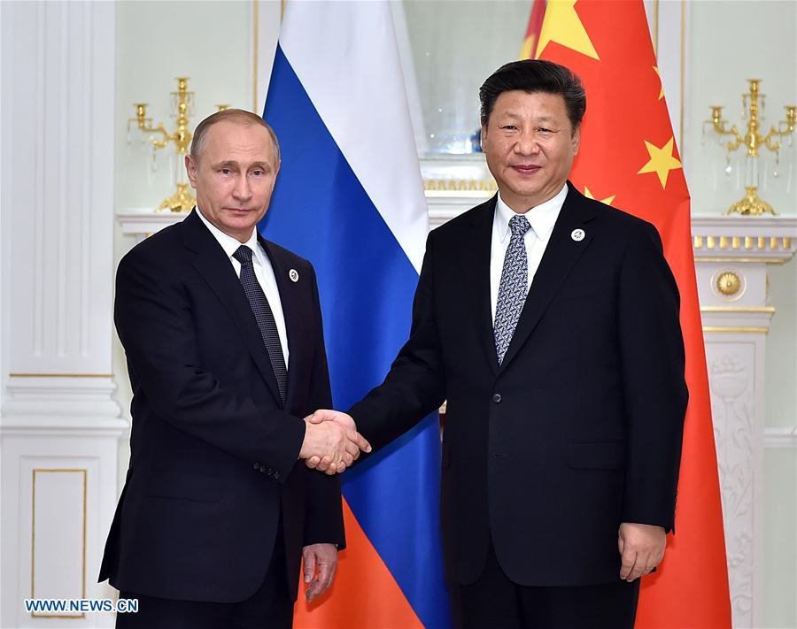 Chinese President Xi Jinping (R) meets with Russian President Vladimir Putin in Tashkent, Uzbekistan, June 23, 2016. (Xinhua/Li Tao) 