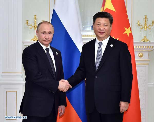 TASHKENT, June 23, 2016 (Xinhua) -- Chinese President Xi Jinping (R) meets with Russian President Vladimir Putin in Tashkent, Uzbekistan, June 23, 2016. (Xinhua/Li Tao)