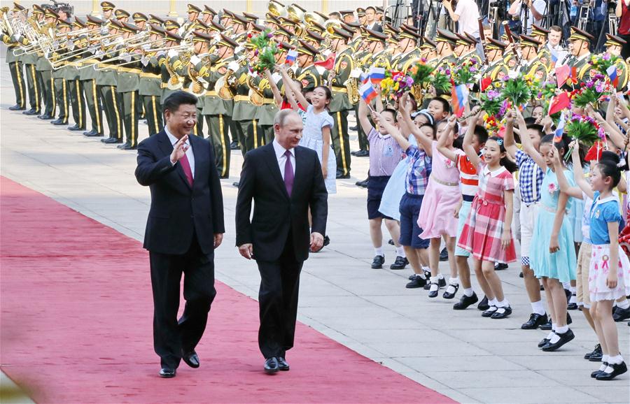 BEIJING, June 25, 2016 (Xinhua) -- Chinese President Xi Jinping (L) holds a welcoming ceremony for Russian President Vladimir Putin before their talks at the Great Hall of the People in Beijing, capital of China, June 25, 2016. (Xinhua/Ju Peng) 