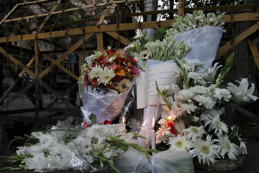 Photo taken on July 3, 2016, shows flowers laid in front of a Spanish restaurant in memory of victims killed in an attack in Dhaka