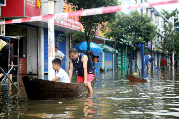 Photo taken on July 3, 2016 shows the scene of a waterlogged street in Xuancheng city, East China