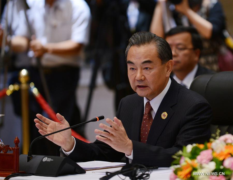 Chinese Foreign Minister Wang Yi attends the meeting with his counterparts from 10 members of the Association of Southeast Asian Nations (ASEAN) in Vientiane, capital of Laos, on July 25, 2016. China and ASEAN reaffirmed their efforts on Monday to "promote peace, stability, mutual trust and confidence" in the South China Sea. (Xinhua/Liu Yun)