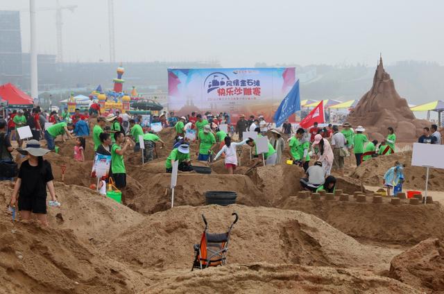 A sand sculpture competition has attracted many locals and tourists to the waterside.