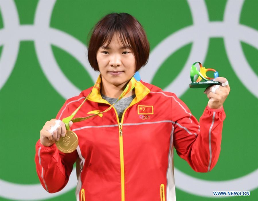 Xiang Yanmei of China celebrates during the awarding ceremony for the women