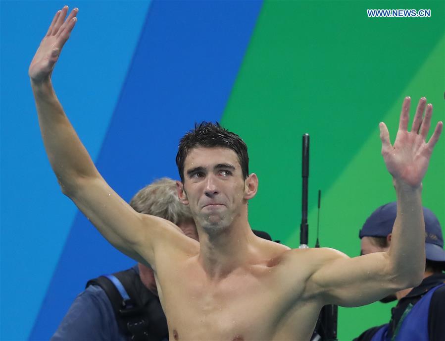 Michael Phelps of the United States celebrates after the men