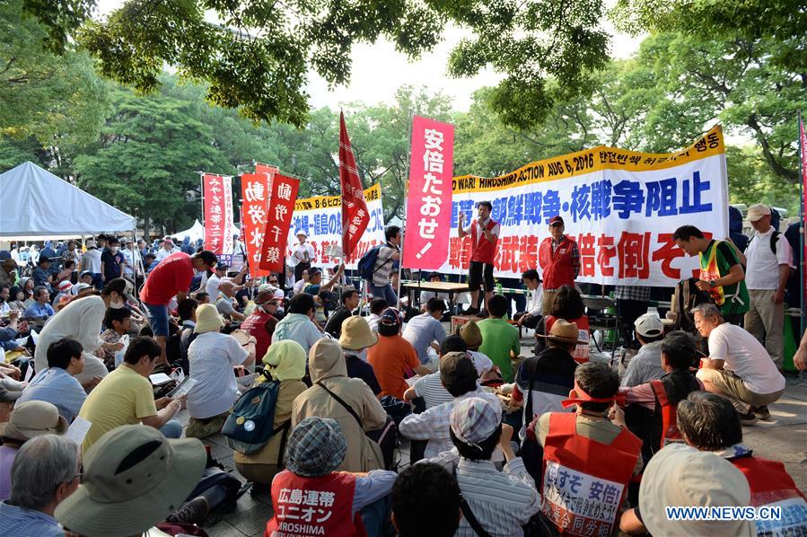 People attend a protest near the Peace Momorial Park in Hiroshima, Japan, on Aug. 6, 2016. Hiroshima, the city that suffered U.S. atomic bombing in 1945 during World War II, commemorated the 71st anniversary of the bombing on Saturday at the city