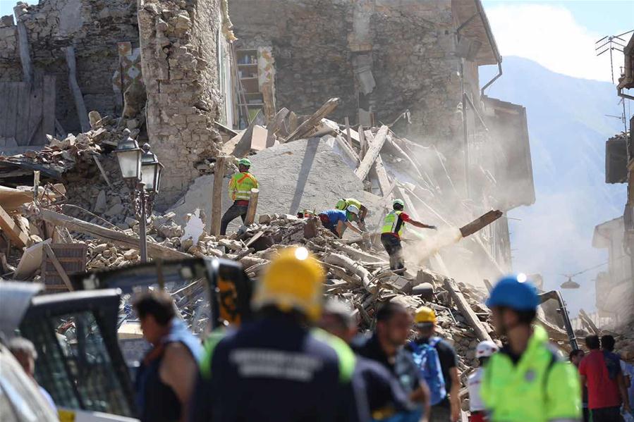 Photo taken on Aug. 24, 2016 shows damaged houses after the earthquake in Amatrice, central Italy. The 6.0 magnitude earthquake hit the city of Rieti at 3:32 a.m. Wednesday (0132 GMT), with a shallow depth of 4.2 km, according to the National Institute of Volcanology and Seismology. (Xinhua/Jin Yu)