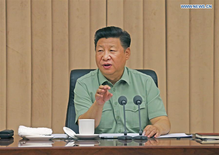 Chinese President Xi Jinping, also general secretary of the Communist Party of China Central Committee and chairman of the Central Military Commission, delivers a speech during an inspection of the offices of the People