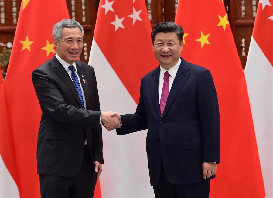 Chinese President Xi Jinping (R) meets with his Brazilian counterpart Michel Temer, who is here to attend the G20 summit, in Hangzhou, capital city of east China