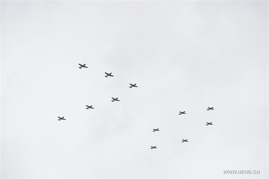 The Sky Wing Air Demonstration Team performs in the sky during the PLA Air Force Aviation Open Day in Changchun, capital city of northeast China