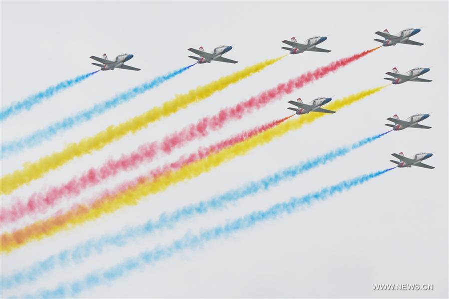 The Red Falcon Air Demonstration Team performs in the sky during the PLA Air Force Aviation Open Day in Changchun, capital city of northeast China