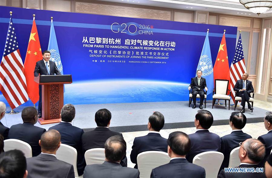 Chinese President Xi Jinping (L), U.S. President Barack Obama (R) and Secretary-General of the United Nations Ban Ki-moon attend the deposit of instruments of joining the Paris Agreement in Hangzhou, capital city of east China