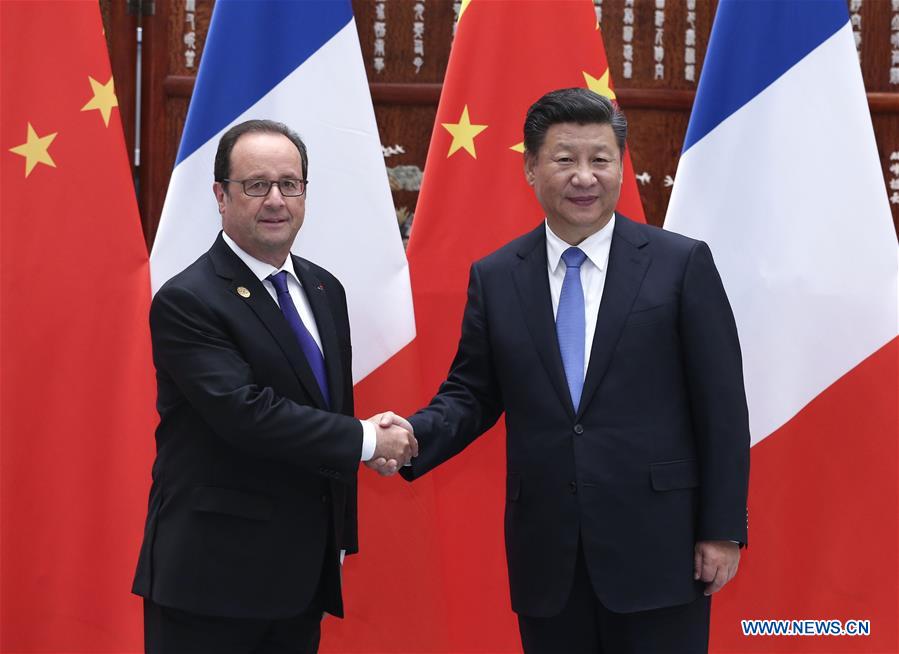 Chinese President Xi Jinping (R) meets with French President Francois Hollande, who is here to attend the Group of 20 (G20) summit, in Hangzhou, capital of east China