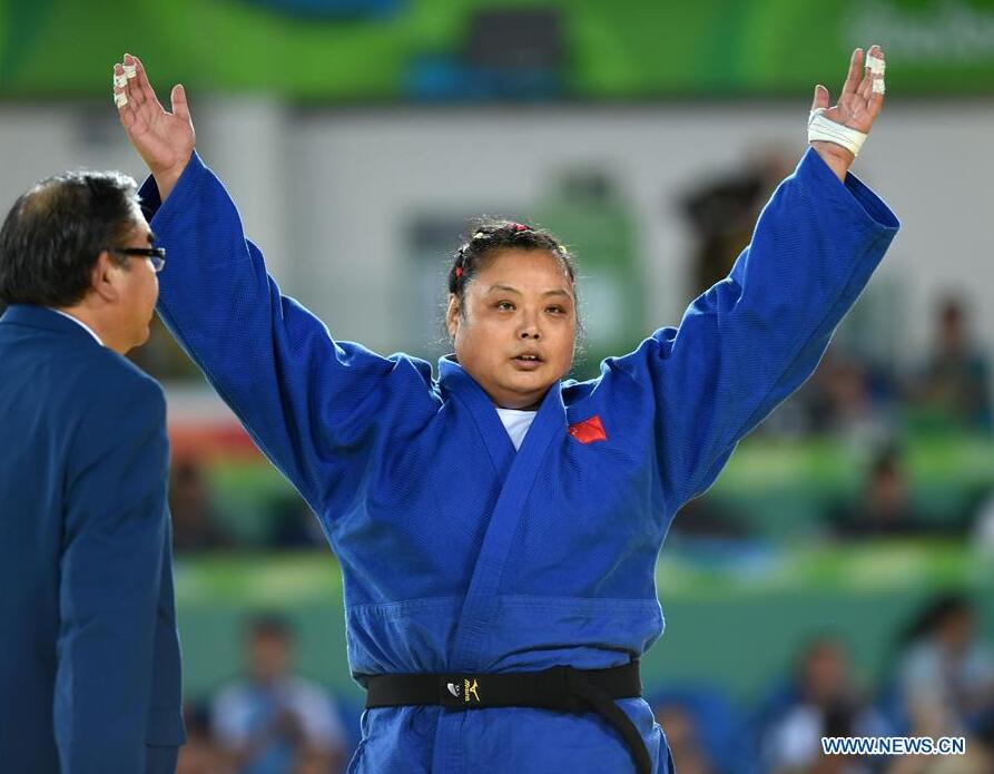 Yuan Yanping of China celebrates after the Women