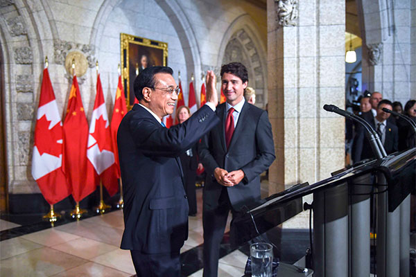 Premier Li Keqiang and Canadian Prime Minister Justin Trudeau met with journalists on Sept 22 in Ottawa, the capital city of Canada.