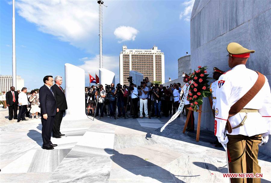 Chinese Premier Li Keqiang lays a wreath at the monument of Jose Julian Marti Perez and visited a local memorial hall in memory of the Cuban national hero in Havana on Sept. 24, 2016. Jose Julian Marti Perez, a great poet, national hero and thinker of Cuba, dedicated his short life to Cuba’s independence and freedom in Latin America. He participated in revolutionary activities against colonization when he was 15 years old and died on the battlefield fighting for Cuba’s independence at the age of 42. [Photo: Xinhua]         