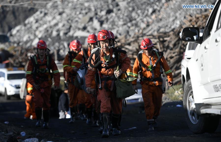 Rescuers prepare to go down the coal mine for rescue work in Shizuishan City, northwest China