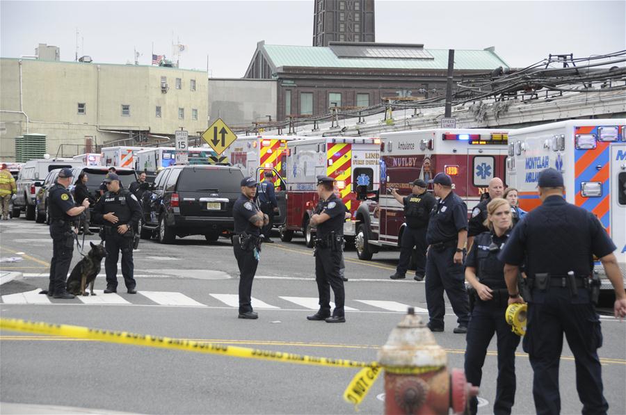 Rescuers gather near the Hoboken station in New Jersey, the United States, Sept. 29, 2016. One person was confirmed dead and some 100 people injured after a transit train crashed into Hoboken station, the U.S. state of New Jersey, during Thursday morning