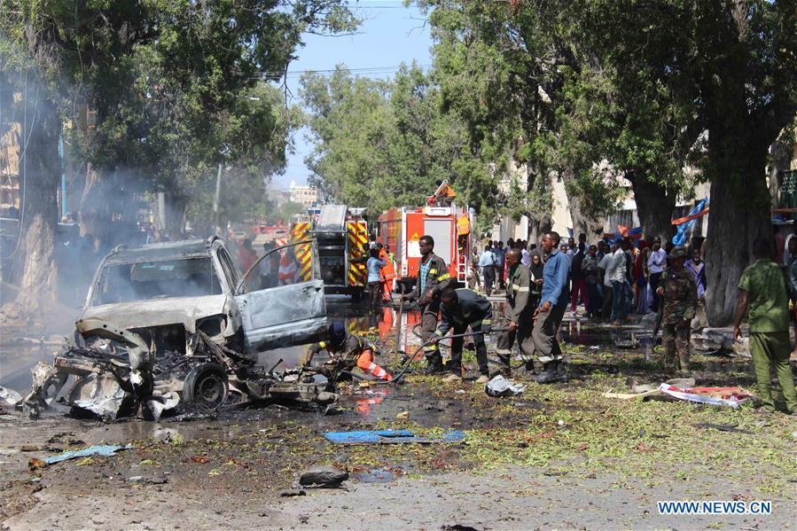 Firefighters work at an explosion site in Mogadishu, Somalia, on Oct. 1, 2016. At least four people were killed and several others injured as an explosion hit a restaurant in the Somali capital Mogadishu on Saturday, police said. (Xinhua/Faisal Isse) 