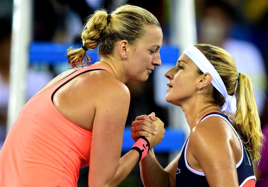 Petra Kvitova (L) of the Czech Republic greets Dominika Cibulkova of Slovakia after winning the women