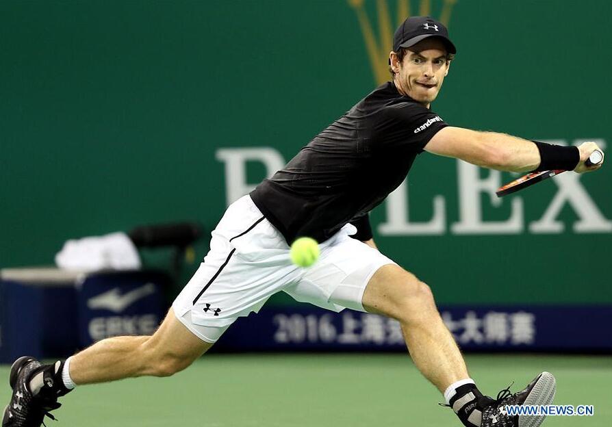 Andy Murray of Britain returns the ball during the men