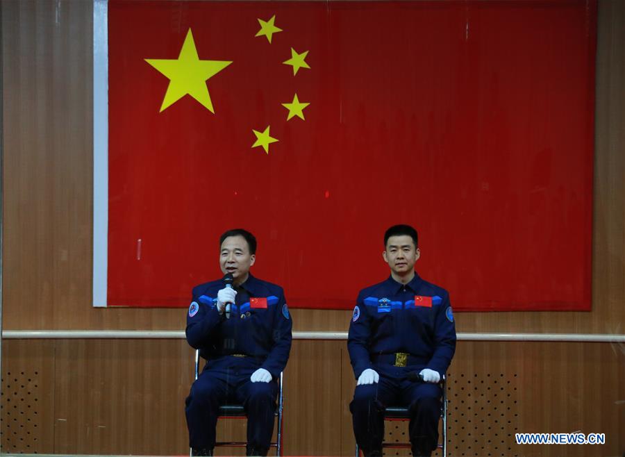 Chinese astronauts Jing Haipeng (L) and Chen Dong meet the media at a press conference at the Jiuquan Satellite Launch Center in northwest China, Oct. 16, 2016. The two male astronauts will carry out the Shenzhou-11 mission. The Shenzhou-11 manned spacecraft will be launched at 7:30 a.m. Oct. 17, 2016 Beijing Time (2330 GMT Oct. 16). (Xinhua/Li Gang) 