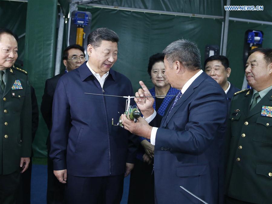 Chinese President Xi Jinping visits an exhibition on the high-technology achievements resulting from military and civilian cooperation in Beijing, capital of China, Oct. 19, 2016. (Xinhua/Ju Peng)