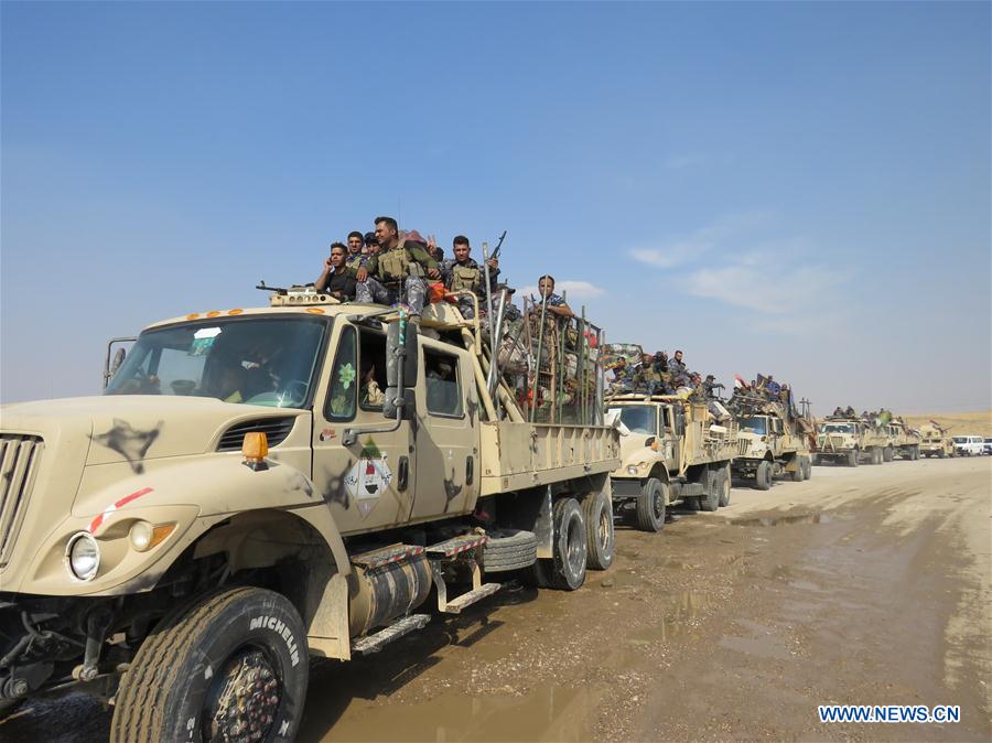 Iraqi soldiers reinforce to guard the Bartella frontline, east of Mosul, Iraq, on Oct. 26, 2016. Iraqi security forces on Wednesday inched to the eastern fringes of the city of Mosul, and made progress on other routes around the city preparing for the major battle to storm the city and drive out the Islamic State (IS) militant group from its last major stronghold in Iraq, a security source said. (Xinhua/Khalid Davood) 