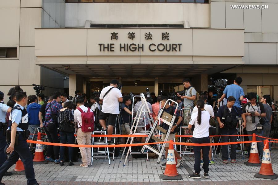 Media wait outside Hong Kong