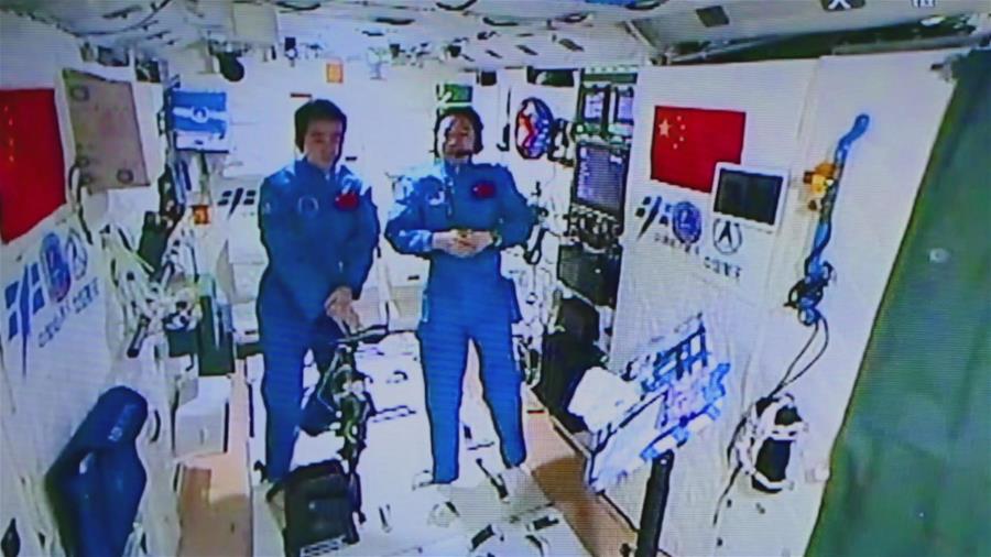 Photo provided by Astronaut Center of China shows Chinese astronauts Jing Haipeng (R) and Chen Dong accept their first earth-space interview in Tiangong-2, Nov. 15, 2016. Chinese astronauts Jing Haipeng and Chen Dong are currently on a 33-day space journey and acting as Xinhua special correspondents. On Tuesday, they talked with their copy desk on earth for the first time. (Xinhua)