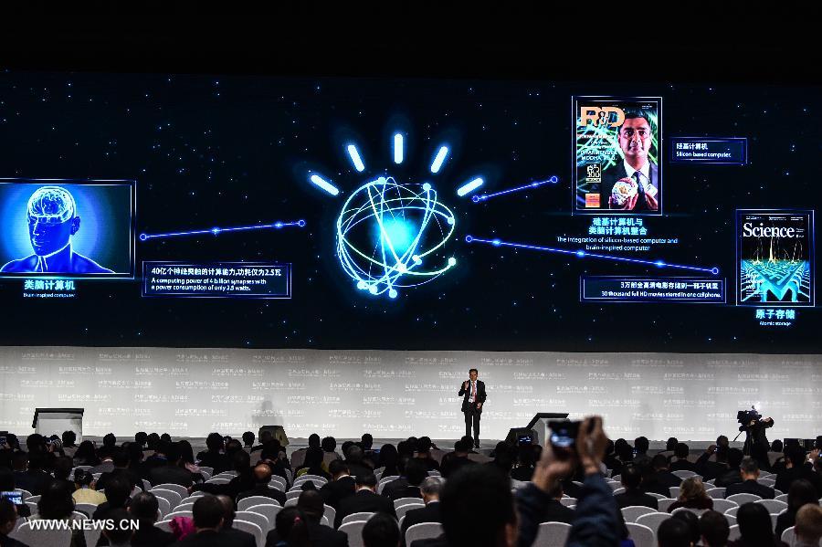 A representative of IBM introduces a brain-inspired computer during a release ceremony of world leading internet scientific and technological achievements at the 3rd World Internet Conference in Wuzhen, east China