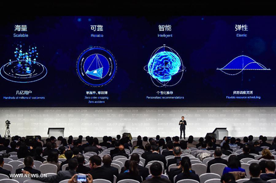 A representative of Alibaba Group introduces a big data cloud computing platform during a release ceremony of world leading internet scientific and technological achievements at the 3rd World Internet Conference in Wuzhen, east China