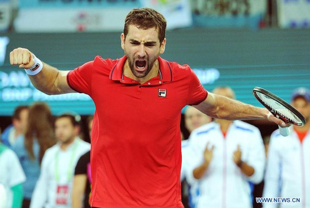 Marin Cilic of Croatia celebrates after the Davis Cup World Group final singles match against Federico Delbonis of Argentina in Zagreb, capital of Croatia, Nov. 25, 2016. Marin Cilic won 3-2. (Xinhua/Miso Lisanin)