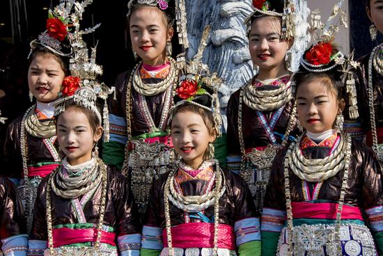 More than a thousand people dressed in traditional clothing, belted out folk songs simultaneously to open the annual festival.