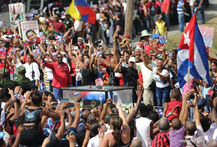 People greet the caravan carrying the ashes of Cuban revolutionary leader Fidel Castro upon its arrival in Santiago de Cuba, southeastern Cuba, on Dec. 3, 2016. As the caravan carrying the ashes of Fidel Castro reached its final destination in Santiago De Cuba, hundreds of thousands of Cubans had come together over the last four days to bid farewell to the revolution leader. Fidel Castro passed away on Nov. 25 at the age of 90. (Xinhua/David de la Paz)