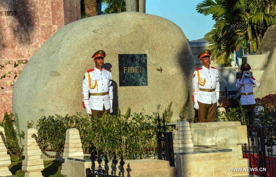 Image provided by the Cuban News Agency shows honor guards standing at the tomb of Cuban revolutionary leader Fidel Castro, at the Santa Ifigenia Cemetery in the city of Santiago de Cuba, Cuba, on Dec. 4, 2016. The remains of the Cuban revolutionary leader and former President Fidel Castro were buried Sunday morning at the Santa Ifigenia cemetery in Santiago de Cuba. (Xinhua/Marcelino Vazquez/Cuban News Agency)