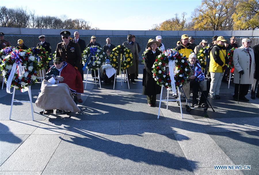 Pearl Harbor survivor veterans attend the 75th anniversary commemoration of Pearl Harbor attack, at the National World War II Memorial in Washington D.C., the United States, Dec. 7, 2016. (Xinhua/Yin Bogu) 