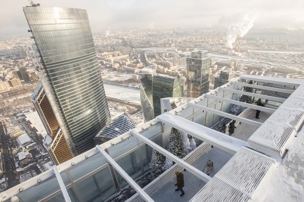 Visitors skate on the BMW Ice Rink 354 located on the 86th storey of the Moscow City OKO Tower. 