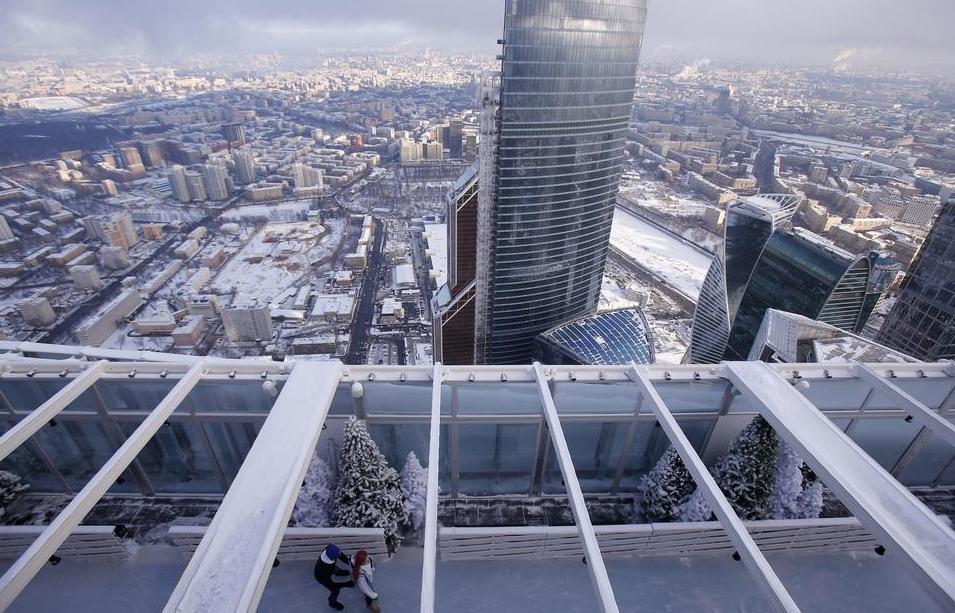 Visitors skate on the BMW Ice Rink 354 located on the 86th storey of the Moscow City OKO Tower. 