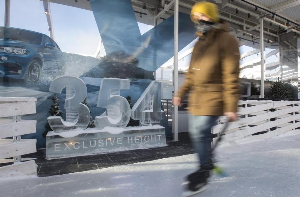 Visitors skate on the BMW Ice Rink 354 located on the 86th storey of the Moscow City OKO Tower. 