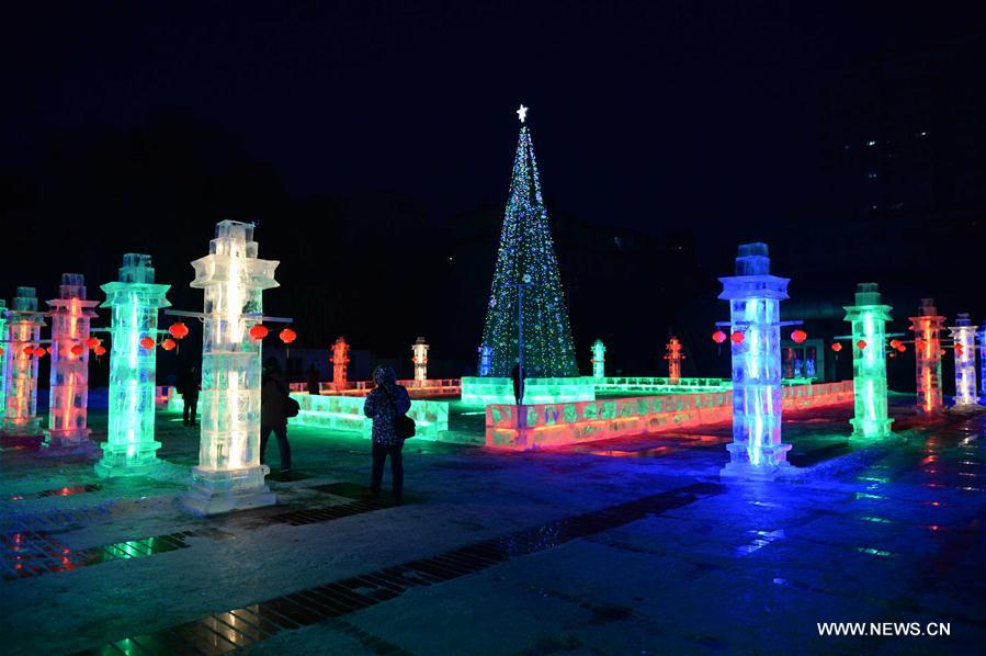 People enjoy lanterns during the 43rd Ice Lantern Exhibition in Harbin, capital of northeast China