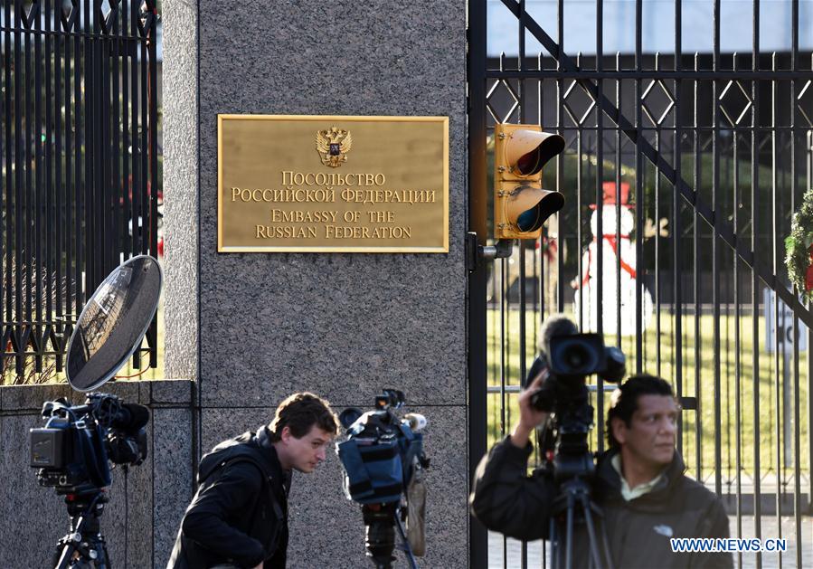 Journalists are seen outside the Russian Embassy to the United States in Washington D.C., the United States, on Dec. 29, 2016. The White House on Thursday announced sanctions against Russian entities and individuals over alleged hacking during the 2016 U.S. presidential election. In addition, the U.S. State Department on Thursday announced ejection of 35 Russian government officials from the United States. (Xinhua/Yin Bogu)