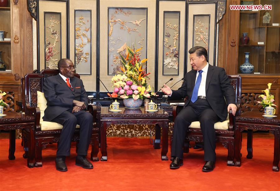 Chinese President Xi Jinping (R) meets with his Zimbabwean counterpart, Robert Gabriel Mugabe, in Beijing, capital of China, Jan. 9, 2017. (Xinhua/Yao Dawei)