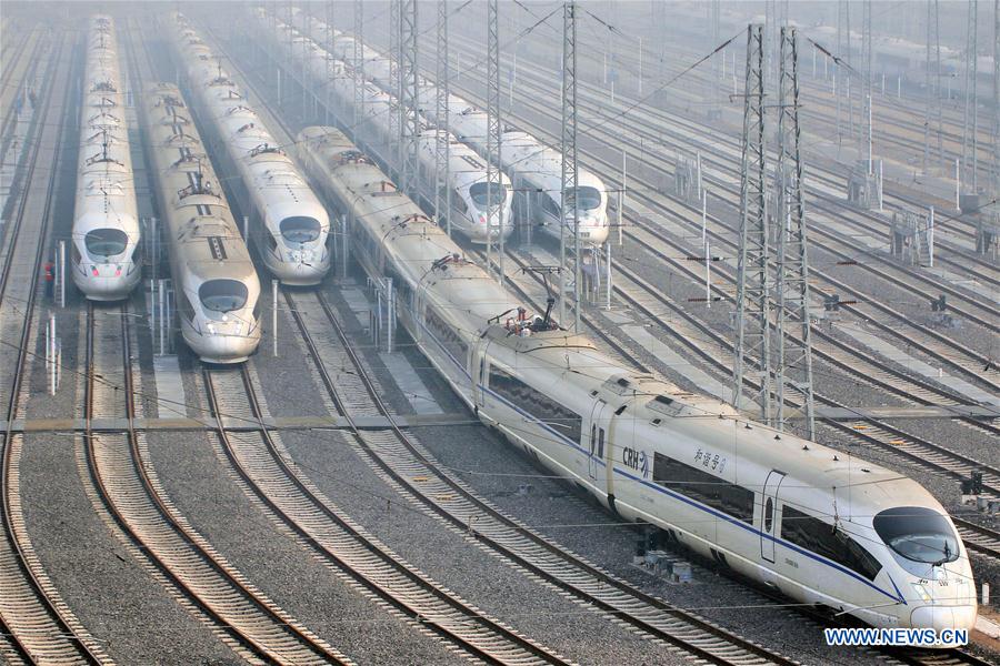 Bullet trains wait on the high-speed railway depot in Qingdao City, east China