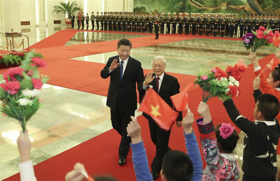 Chinese President Xi Jinping (L), who is also General Secretary of the Communist Party of China Central Committee, holds a welcoming ceremony for Nguyen Phu Trong, General Secretary of the Communist Party of Vietnam Central Committee, before their talks in Beijing, capital of China, Jan. 12, 2017. (Xinhua/Pang Xinglei)