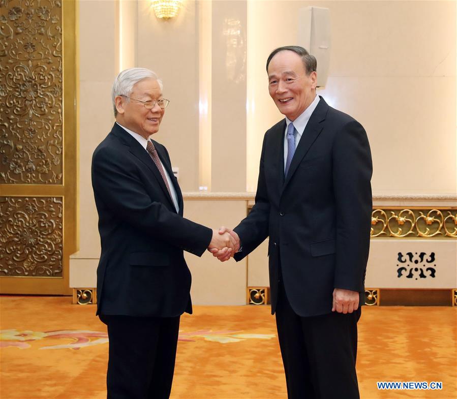 Wang Qishan (R), secretary of the Communist Party of China (CPC) Central Commission for Discipline Inspection, meets with Nguyen Phu Trong, General Secretary of the Communist Party of Vietnam Central Committee, in Beijing, capital of China, Jan. 13, 2017. (Xinhua/Liu Weibing)