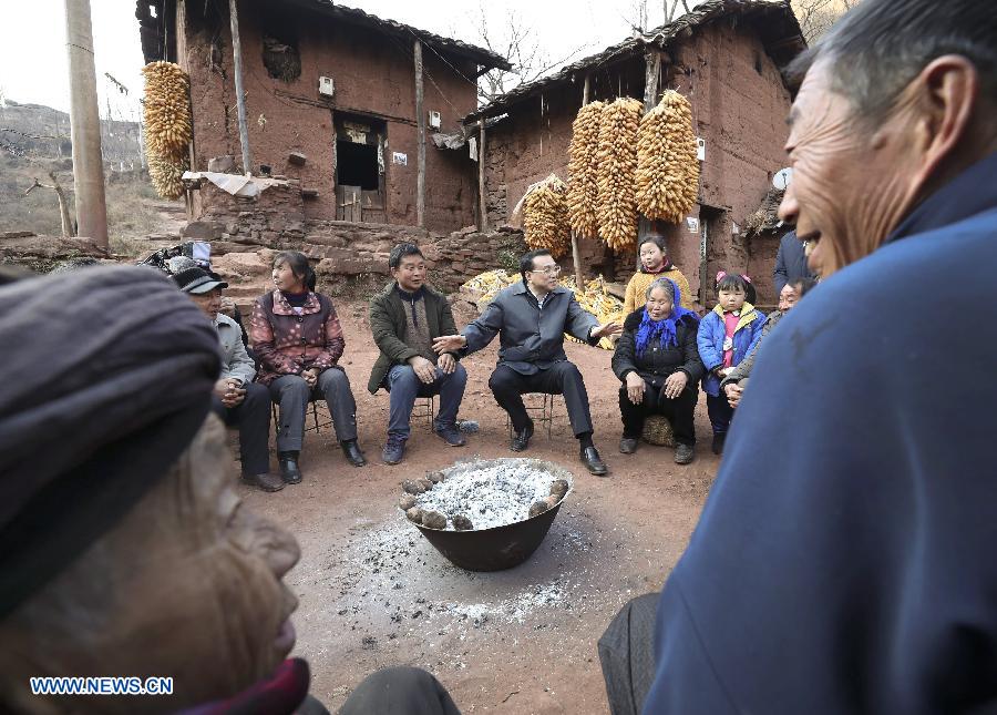 Chinese Premier Li Keqiang visits villagers of Lianhe Village in Zhaoyang District of Zhaotong City, southwest China