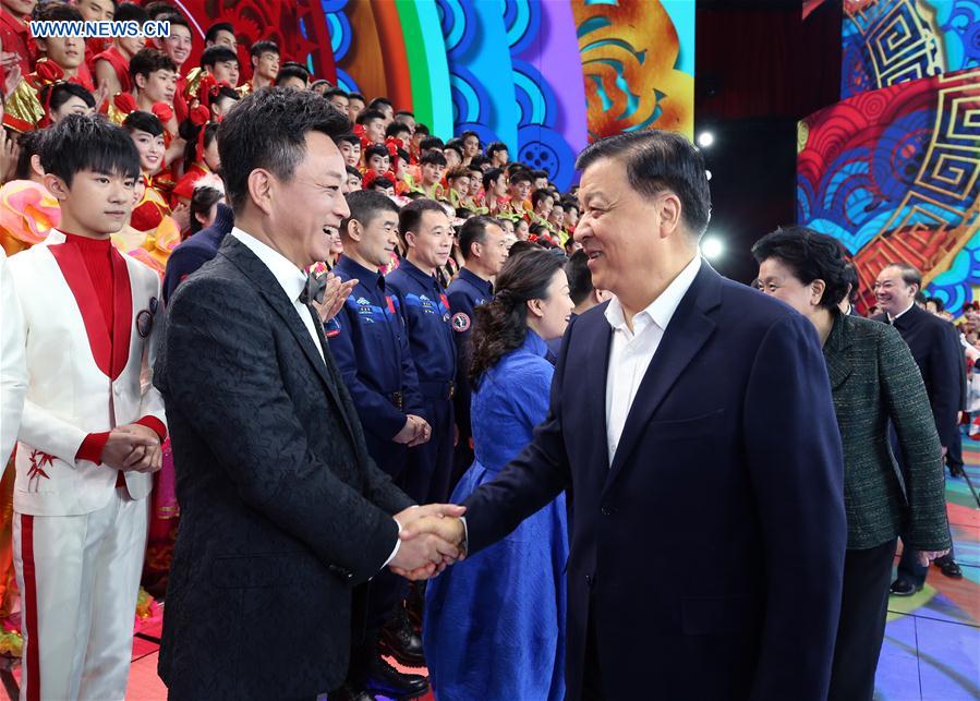 Liu Yunshan (R front), a member of the Standing Committee of the Political Bureau of the Communist Party of China Central Committee, visits and extends Spring Festival greetings to staffs at the rehearsal for the Spring Festival TV gala in Beijing, capital of China, Jan. 25, 2017. The gala, an annual celebration broadcast by the China Central Television on the Chinese New Year