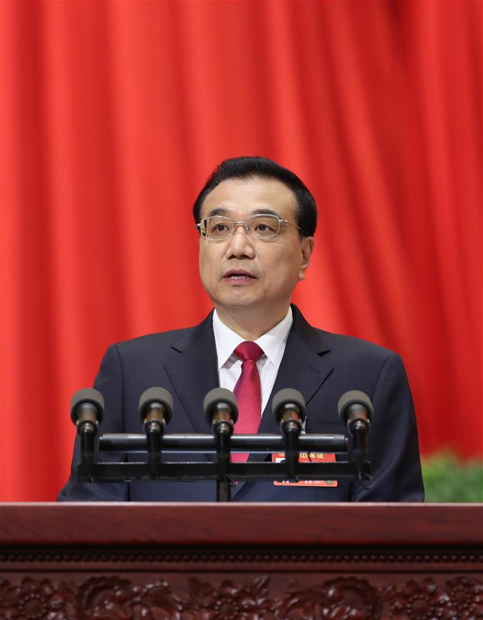 Chinese Premier Li Keqiang delivers a government work report during the opening meeting of the fifth session of China