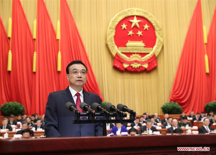 Chinese Premier Li Keqiang delivers a government work report during the opening meeting of the fifth session of China